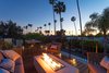 Rooftop deck with fire pit with seating for outdoor entertaining. Photo 15 of Milwood Residence modern home
