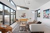 Modern home with Living Room, Rug Floor, Stools, Recessed Lighting, Pendant Lighting, Lamps, and Sofa. Second level detached accessory space gives added flexibility. Photo 14 of Milwood Residence