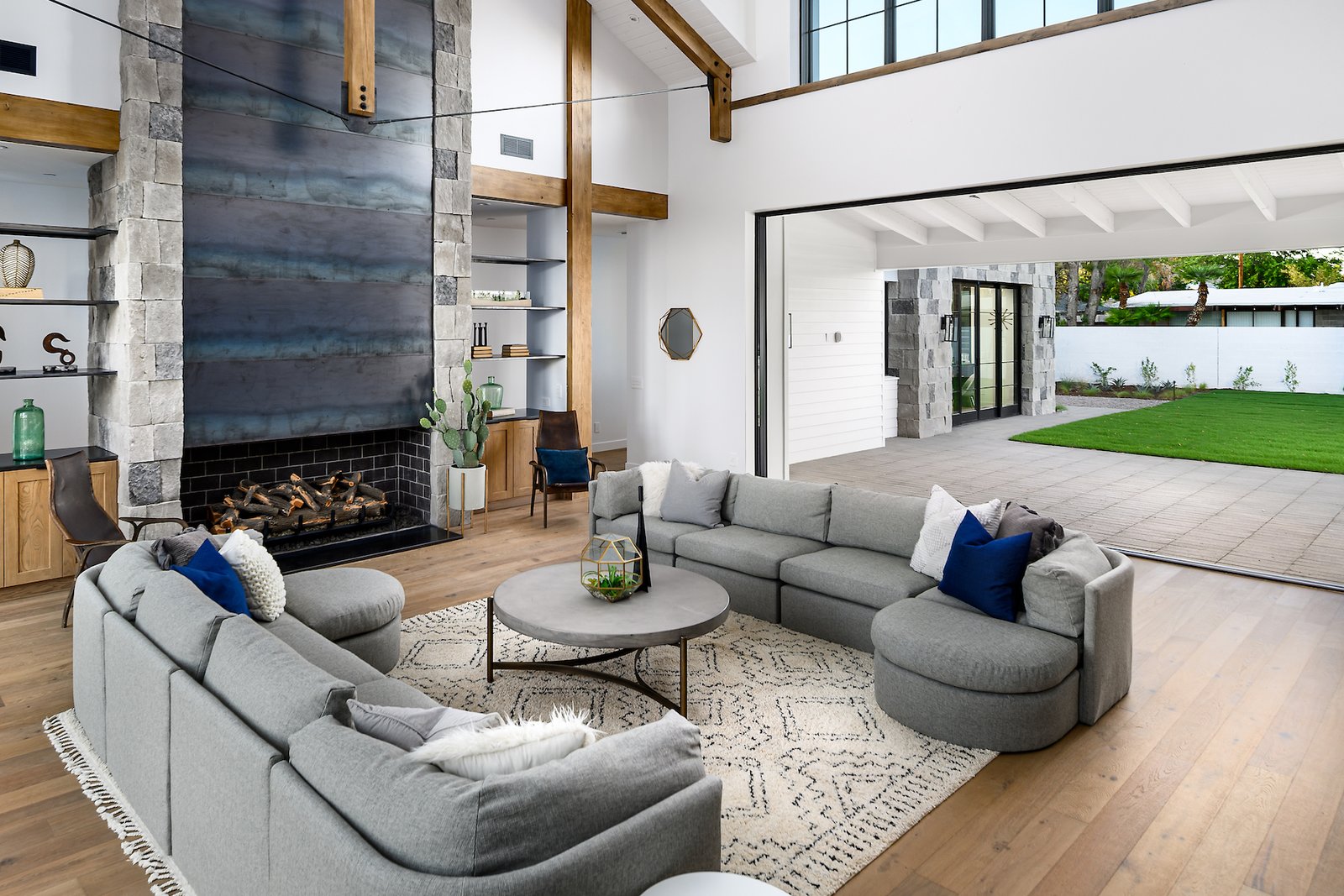 As the great room's pocketing glass doors disappear, the fun begins. Beyond is The Stone Bar, a destination game room with an indoor/outdoor bar and entertaining space behind more disappearing doors.  
