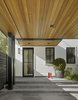 Modern home with Garage and Detached Garage Room Type. Cedar carport and side entry. Red boots to boot. Photo 5 of Wine Country Cool
