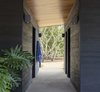 Modern home with Bath Room, Wall Lighting, Wall Mount Sink, and Concrete Floor. Peaceful & Serene Photo 3 of Napa Pool House