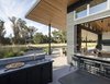 Modern home with Outdoor, Grass, Trees, Lap Pools, Tubs, Shower, Hanging Lighting, Back Yard, and Stone Patio, Porch, Deck. Generously shady roof overhangs provide shelter from the summer heat and oversized doors allow air to move through. Photo 5 of Napa Pool House
