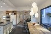 Modern home with Dining Room, Chair, Ceiling Lighting, Pendant Lighting, Table, Shelves, and Slate Floor. Eat in kitchen with lacquer cabinets, wood details and slate floor. Photo 5 of Professors Row