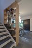 Modern home with Living Room, Shelves, Pendant Lighting, and Slate Floor. Open shelves in kitchen allows views from hallway to the eating area and garden. Photo 4 of Professors Row