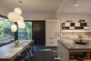 Modern home with Dining Room, Chair, Track Lighting, Table, Ceiling Lighting, Pendant Lighting, and Slate Floor. Eat in kitchen with lacquer cabinets, wood details and slate floor. Photo 6 of Professors Row