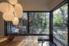 Modern home with Dining Room, Ceiling Lighting, Chair, Pendant Lighting, Slate Floor, and Table. Floor to ceiling windows at the kitchen Photo 7 of Professors Row