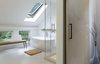 Modern home with Bath Room, Freestanding Tub, and Soaking Tub. In the master bathroom, a soaking tub sits beneath a sloped roof with a skylight. Photo 6 of Modern Barns