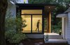 Modern home with Exterior, House Building Type, and Wood Siding Material. Floor to ceiling glass on the entry side and a fixed wood screen on the living side make a simple composition that is warm and inviting as well as being private. Photo 4 of Modern Barns