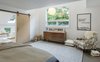 Modern home with Bedroom, Pendant Lighting, Chair, Bed, Dresser, and Rug Floor. The master bedroom suite features two walk-in closets with sliding barn doors made of birch plywood. Photo 8 of Modern Barns