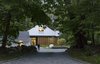 Modern home with Outdoor, Trees, Walkways, Front Yard, and Shrubs. A cedar screen was also added to the front of the living barn, providing privacy while allowing light into the home. Photo 3 of Modern Barns
