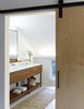 Modern home with Bath Room, Rug Floor, and Cork Floor. Upstairs, original cork flooring was coated with a semi-transparent grey stain, giving it a "fresh look". Photo 7 of Modern Barns