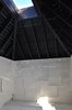 The layers of thick wool felt are shingled along the walls and seating, fastened with galvanized roofing nails to the wall studs. The undyed wool felt acts as blanket, insulation and wind stop; it is naturally fire-resistant and can withstand the elements that enter through the gaps in the walls. Photo 3 of Warming Hut modern home