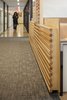 Modern home with Hallway and Carpet Floor. Once off the elevator, a visitor’s eye is guided from one softly lit wood screen to the next until their final destination. Photo 3 of Harvard Student Services