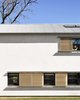 Eco-conscious and energy-efficient, the structure’s heavily insulated walls and panels help the house approach passive energy standards. Exterior sliding shutters and deep overhangs contribute environmental benefits, as does the breeze wafting off the lake. Photo 8 of Modern Texas Prefab modern home