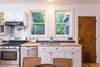 The kitchen includes stainless steel appliances with a pot filler. Photo 11 of QUINTESSENTIAL BERKELEY modern home