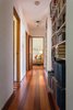 A long hallway lined with bookshelves Photo 14 of QUINTESSENTIAL BERKELEY modern home