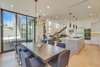 Modern home with Dining Room, Chair, Ceiling Lighting, Table, Track Lighting, Accent Lighting, Light Hardwood Floor, and Pendant Lighting. Dining/Kitchen Photo 8 of The Rosewood Residence