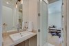 Modern home with Bath Room, Marble Counter, Enclosed Shower, Drop In Sink, Ceiling Lighting, Recessed Lighting, Wall Lighting, One Piece Toilet, and Porcelain Tile Floor. Downstairs Bathroom Photo 11 of The Rosewood Residence