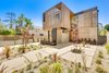 Modern home with Outdoor, Front Yard, Garden, Desert, Trees, Shrubs, Hardscapes, Raised Planters, Flowers, Walkways, Pavers Patio, Porch, Deck, Horizontal Fences, Wall, Wood Fences, Wall, Landscape Lighting, and Vertical Fences, Wall. Front Exterior, Day Photo 2 of The Rosewood Residence