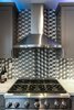 Modern home with Kitchen, Marble Counter, Colorful Cabinet, Wood Cabinet, Mosaic Tile Backsplashe, Cooktops, Range, Ceramic Tile Backsplashe, Accent Lighting, and Range Hood. Close up of range and hood Photo 8 of Lincoln Kitchen