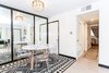 Modern home with Dining Room, Table, Vinyl Floor, Chair, and Ceiling Lighting. Lucite ghost chairs in dining room. Photo 3 of California Street Home