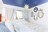 Modern home with Bedroom, Bed, Ceiling Lighting, and Wall Lighting. Whimsical bedroom with painted ceiling Photo 4 of California Street Home