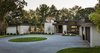Modern home with Outdoor, Trees, Front Yard, Shrubs, Flowers, Raised Planters, Walkways, Large Patio, Porch, Deck, and Landscape Lighting. Entrance Court Photo 3 of Sunfish Lake Residence