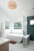 Modern home with Bath Room, Engineered Quartz Counter, Freestanding Tub, Porcelain Tile Floor, Undermount Sink, Open Shower, Ceiling Lighting, Pendant Lighting, and Ceramic Tile Wall. Master Bath Photo 13 of 20th Street