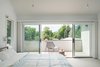 Modern home with Chair, Pendant Lighting, Bed, and Carpet Floor. Master Bedroom Photo 15 of 20th Street