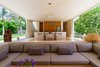 Modern home with Living Room, Medium Hardwood Floor, Standard Layout Fireplace, Ceiling Lighting, and Sectional. Sitting area Photo 6 of Casa Sisal