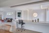 Modern home with Living Room, Pendant Lighting, Light Hardwood Floor, Recessed Lighting, and Sectional. A low window at the guest room gives a view of the garden while preserving privacy. Photo 13 of Arlington Solar