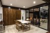 Modern home with Dining Room, Two-Sided Fireplace, Table, Travertine Floor, Chair, Storage, and Ceiling Lighting. Dinning and terrace Photo 6 of CQ12