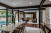 Modern home with Living Room, Sofa, Standard Layout Fireplace, Ceiling Lighting, and Wood Burning Fireplace. Dinning and living room Photo 12 of CQ12
