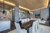 Modern home with Dining Room, Chair, Ceiling Lighting, Recessed Lighting, Table, Accent Lighting, Medium Hardwood Floor, Dark Hardwood Floor, Gas Burning Fireplace, and Two-Sided Fireplace. The grand entry opens onto to the spacious great room. Photo 4 of Two Creeks