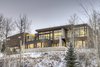 Modern home with Exterior, House, Metal Roof Material, Wood Siding Material, Stone Siding Material, Metal Siding Material, Glass Siding Material, and Shed RoofLine. Situated above the Two Creeks base area in the ski town of Snowmass Village, Colorado, this ski-in, ski-out residence is a skier’s paradise. This elegant home is 6,300 square feet sprawled across two levels with views for miles.
The rich wood and contemporary stone create an exterior material palette that is warm and welcoming. Photo of Two Creeks