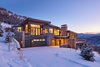 Modern home with Exterior, Shed RoofLine, House Building Type, Stucco Siding Material, Stone Siding Material, Metal Siding Material, and Metal Roof Material. Wedged into the mountainous landscape, the form follows the slope of the site, with the back façade opening up to the view. Photo of Terrace Drive