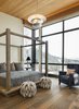 Modern home with Bedroom, Bed, Ceiling Lighting, Medium Hardwood Floor, Chair, and Pendant Lighting. All 6 bedrooms afford walkout patios and incredible mountain scenes. Photo 10 of Two Creeks