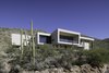 Modern home with Sliding Window Type, Metal, Outdoor, Slope, Desert, Front Yard, and Boulders. Project Name: Sabino Canyon Home Photo of Sabino Canyon Home