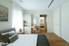 Modern home with Bedroom, Bed, Night Stands, Dresser, Wardrobe, Chair, Bench, Ceiling Lighting, Storage, and Medium Hardwood Floor. The current master bedroom Photo 8 of An Ideal Home Renovation for the Golden Years