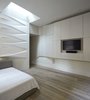 Modern home with Living Room, Recessed Lighting, Medium Hardwood Floor, Bookcase, and Wall Lighting. Build-In Cabinetry Photo 5 of K Residence