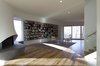 Modern home with Living Room, Bench, Wood Burning Fireplace, Medium Hardwood Floor, Ceiling Lighting, and Recessed Lighting. View of Fireplace and Library Photo 4 of DR Residence