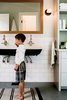 Modern home with Bath Room, Wall Mount Sink, Concrete Floor, Wall Lighting, and Subway Tile Wall. Lake Chelan Photo 9 of Lake Chelan