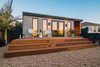 Modern home with Outdoor, Front Yard, Hardscapes, Decking Patio, Porch, Deck, Wood Patio, Porch, Deck, Raised Planters, Large Patio, Porch, Deck, Decomposed Granite Patio, Porch, Deck, Horizontal Fences, Wall, Wood Fences, Wall, and Landscape Lighting. Front deck and facade Photo of Del Rey Residence