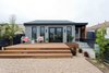 Modern home with Exterior, House Building Type, Small Home Building Type, and Shingles Roof Material. Front Deck & Entry Door Photo 4 of Del Rey Residence