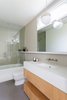 Modern home with Porcelain Tile Floor, Undermount Sink, Engineered Quartz Counter, Quartzite Counter, Alcove Tub, Ceiling Lighting, Recessed Lighting, Enclosed Shower, Accent Lighting, Pendant Lighting, One Piece Toilet, Porcelain Tile Wall, Windows, Metal, and Awning Window Type. Custom Master Bath Vanity Photo 9 of Del Rey Residence