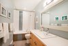 Modern home with Bath Room, Engineered Quartz Counter, Drop In Sink, Ceiling Lighting, Soaking Tub, and Tile Counter. Second bathroom Photo 19 of Bayview Road