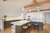 Modern home with Kitchen, Engineered Quartz Counter, White Cabinet, Wood Counter, Tile Counter, Medium Hardwood Floor, Subway Tile Backsplashe, Ceiling Lighting, Wall Oven, Cooktops, Refrigerator, Microwave, and Dishwasher. Kitchen Photo 8 of Bayview Road