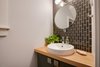 Modern home with Bath Room, Medium Hardwood Floor, Wood Counter, and Tile Counter. Powder room Photo 17 of Bayview Road