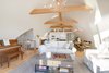 Modern home with Living Room, Sofa, Chair, Coffee Tables, Ceiling Lighting, and Medium Hardwood Floor. Great room looking to kitchen Photo 4 of Bayview Road
