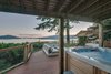 Modern home with Outdoor, Back Yard, Woodland, Slope, Large Patio, Porch, Deck, Trees, and Wood Patio, Porch, Deck. Lower deck with hot tub Photo 13 of Bayview Road